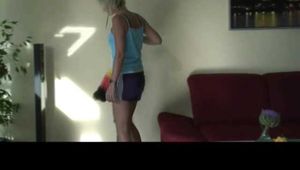 Watching sexy Pia watering flowers and cleaning flowers and the furniture wearing a sexy darkblue shiny nylon shorts and a lightblue top (Video)