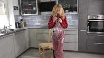 Miss Alice in Nylon rainsuit covered with transparent raingear