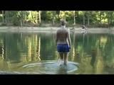 Jenny bathing in a lake and sun bathing wearing sexy adidas shiny nylon shorts and a bikini-top (Video)