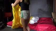Sandra preparing her shiny nylon bed wearing sexy shiny nylon shorts and a top (Video)
