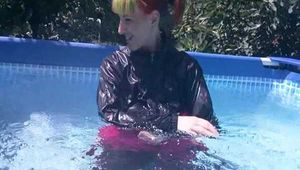 Mara swimming in the pool wearing a sexy rainwear combination (Video)