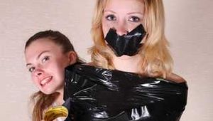 Sasha Swift & Christina Clark - Christina Clark is captured, cuffed, gagged, dominated and wrapped by Sasha Swift