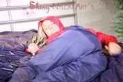 Sonja lolling on bed with a sexy blue rain pants and a red rain jacket enjoying herself and the hood in this material (Pics)