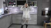 Miss Francine in sexy PVC shorts, white K-Way rainjacket and transparent raingear