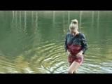 Jenny bathing in a lake and sun bathing wearing sexy red shiny nylon shorts and a rain jacket (Video)