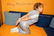 Beautiful archive girl tied and gagged wearing a shiny grey nylon jumpsuit(Pics)