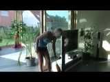 Watching sexy Pia watering flowers and cleaning flowers and the furniture wearing a sexy darkblue shiny nylon shorts and a lightblue top (Video)
