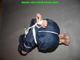 Get 101 Pictures with Lupi tied and gagged in shiny nylon rainwear from 2005-2008!