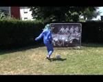 Mara wearing a blue rainwear combination while playing soccer with herself (Video)