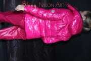 Watching sexy Sandra wearing a sexy pink shiny nylon rain pants and a pink down jacket nestle down in a down cover (Pics)
