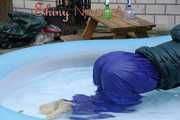 Watching Sandra wearing a sexy blue shiny nylon rainwear bib and a green down jacket while taking a sunbath and a bath in the swimming pool  (Pics)