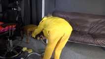 Watching sexy SANDRA vacuum cleaning the studio wearing a sexy yellow rainwear combination (Video)