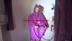 Watching Sandra wearing only a pink shiny nylon raincape under the shower playing with the water (Video)