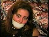 24 YR OLD LATINA HOUSEWIFE MOUTH STUFFED, WRAP TAPE GAGGED, BAREFOOT & TOE TIED (D61-11)