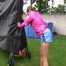 Watch Sandra enjoying the Summer in her shiny nylon Shorts in the Garden