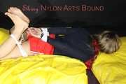 Sexy Sandra being tied and gagged feet on the hands with ropes and a clothgag wearing a sexy red shiny nylon shorts and a shirt (Pics)
