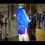 Sonja during her workout on the crosstrainer wearing a supersexy purple adidas shiny nylon shorts and a blue rain jacket (Video)