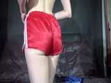 Watch Sonja changing and trieing some of her shiny nylon Shorts 