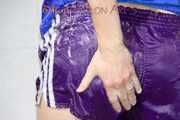 Sonja wearing a sexy purple shiny nylon shorts and a blue rain jacket while taking a shower (Pics)
