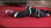 Jill tied, gagged and hooded lying on the floor wearing sexy shiny nylon black rainwear (Video)