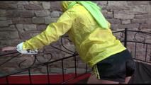 Pia tied and gagged on a princess bed wearing a sexy shiny black shorts and a yellow rain jacket (Video)