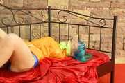 Mara tied and gagged on a princess bed in an old cellar wearing an supersexy shiny lightblue nylon shorts and an orange rain jacket (Pics)