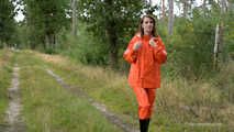 Miss Petra takes a walk in a orange AGU rain suit and rubber boots