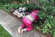 Watching Aiyana wearing supersexy pink shiny nylon rainwear while planting flowers in the garden (Pics)