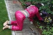 Watching Aiyana wearing supersexy pink shiny nylon rainwear while planting flowers in the garden (Pics)