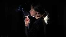 Irina is smoking 100mm cigarette in the dark room