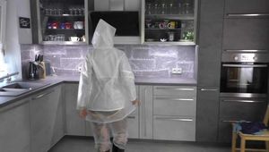 Miss Francine in sexy PVC shorts, white K-Way rainjacket and transparent raingear