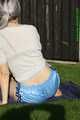 Watch Chloe taking a Sunbath wearing her shiny nylon Shorts under her jeans Shorts 