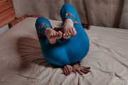 Tied arms and legs in blue leggings and blouse