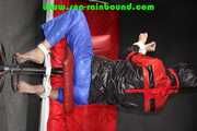 Sexy PIA wearing a sexy blue rainbib and a black/red shiny nylon rainjacket being tied, gagged and hooded on a chair with ropes and a ballgag (Pics)