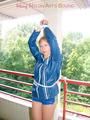Leonie tied and gagged on a pillar wearing a shiny nylon shorts and a rain jacket (Pics)