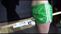 SEXY SONJA tied and gagged with ropes and a bar with a massager between her legs wearing a sexy green shiny nylon shorts and a sexy black rain jacket (Video)