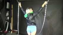 Watching sexy Sonja wearing a sexy lightblue shiny nylon shorts and a black shiny nylon rain jacket being tied and gagged overhead with cuffs, chains and a clothgag (Video)