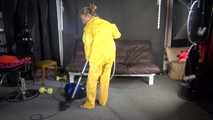 Watching sexy SANDRA vacuum cleaning the studio wearing a sexy yellow rainwear combination (Video)