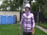 Watch Sandra taking a shower in her new purple shiny nylon down jacket 