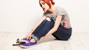 Mia in purple sneakers and cuffs
