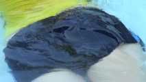 Watching sexy Sonja enjoying the water in the pool and the feeling of shiny nylon on her skin wearing a sexy shiny nylon shorts and a top (Video)