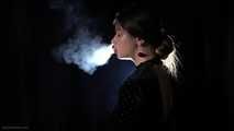 Irina is smoking 100mm cigarette in the dark room