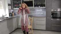 Miss Alice in Nylon rainsuit covered with transparent raingear