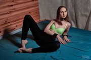 Collar and handcuffs in green bra and leggings