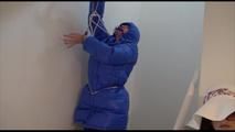 Jill tied, gagged and hooded in a stairway with cuffs wearing a sexy blue PAMY jacket and a rain pants (Video)