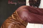 Watching ***SONJA*** wearing a sexy brown shiny nylon rainwear combination preparing her bed an lolling in the bed (Pics)