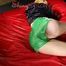 Sexy Sonja wearing a hot green shiny nylon shorts and a black rain jacket posing infront of the camera and lolling on bed (Pics)