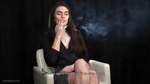 Alla is giving an interview while smoking her favorite cigarettes