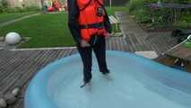 Sonja cools down in the swimming pool wearing sexy blue rainwear and a lifevest (Video)