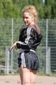 Leonie playing soccer outdoor wearing a sexy black shiny nylon shorts and a sexy black rain jacket (Pics)